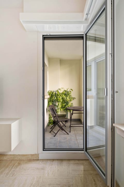 Inviting balcony space with comfortable seating, ideal for enjoying fresh air and lovely views.