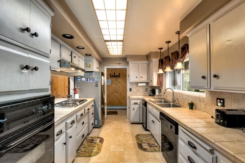 Fully equipped chef’s kitchen with a gas Thermador range and everything needed for home-cooked meals