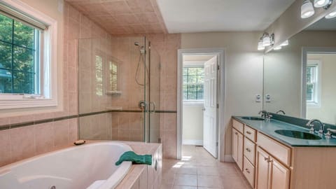 Combined shower/tub, hair dryer, towels, soap