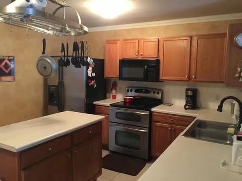 Kitchen Area will full size Refrigerator and Stove