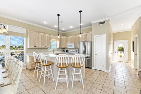 Fully equipped kitchen with extra seating at the breakfast bar.