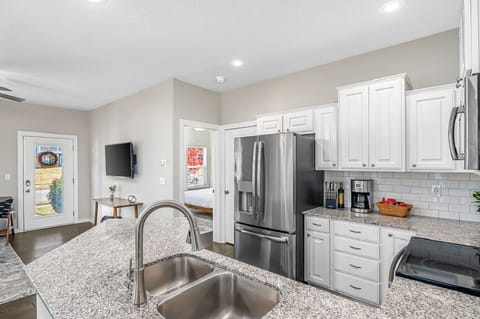 Kitchen and living area, looking into the Primary Suite.