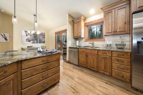 Open gourmet kitchen, dining and family room brings everyone together