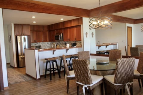 Open kitchen and dining room. All new furniture and wide plank flooring