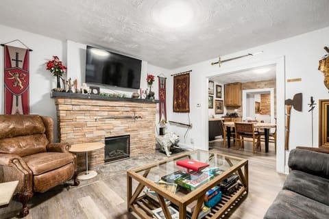 The lion's den includes a large 4K smart TV, an electric fireplace, board games and books.