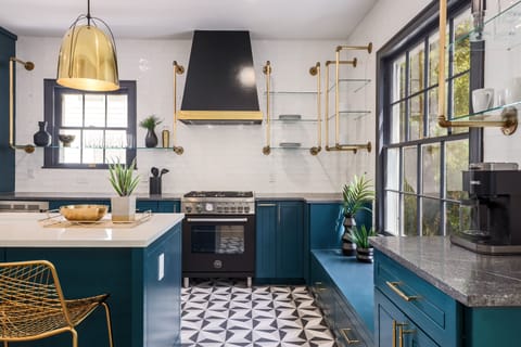 The kitchen has plenty of storage space and chic appliances