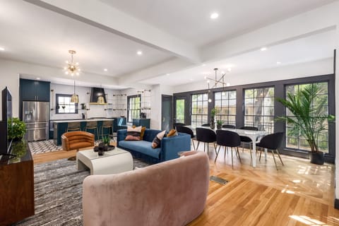 The living, dining and kitchen spaces are open to each other, which is perfect for entertaining