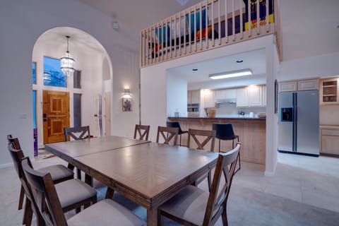 Dining table seats 8 comfortably and extends to accommodate up to 12 guests.