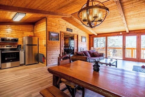 The spacious, open-concept living, dining, and kitchen area.