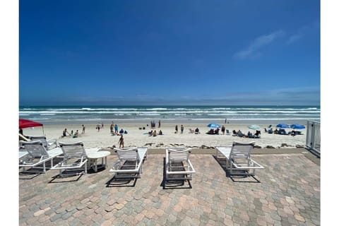 On the beach, sun loungers, beach towels