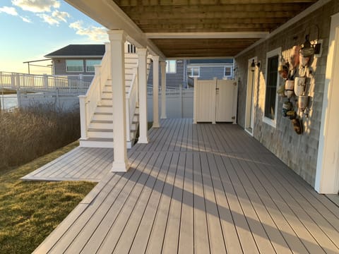 550sf ground level deck, accessible by backstairs to upper deck, outside shower