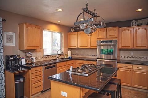 Kitchen with double oven and gas stove top.  Ice maker and RO water system