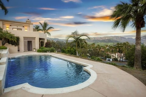 Hill views of pool.  Fence and additional concrete decking has been added since