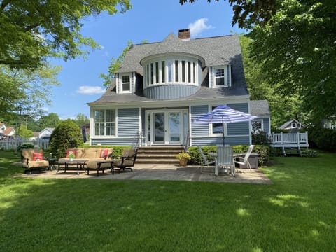 Lakefront home with patio, deck, large flat yard, firepit, and beautiful views!