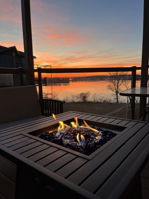 Enjoy a gorgeous lake view while seated comfortably around the fire table.