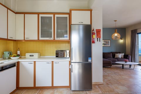 The kitchen is next to the dining area and living room.