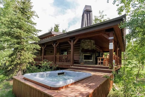 Premium chalet with generous covered deck space including a wood burning fireplace leading out to the hot tub under the stars.
