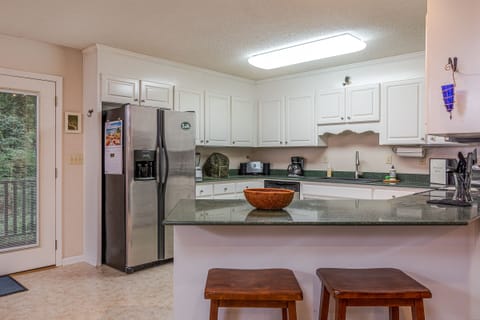Kitchen with bar seating.