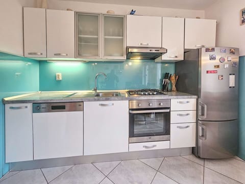 Kitchen Appliance, Kitchen, Countertop, Major Appliance, Cabinetry, Kitchen Stove, Stove, Home Appliance, Kitchen Sink, Interior Design