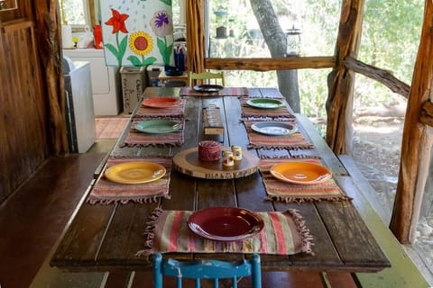Dining table on back screen porch can seat as many as 10 people.  