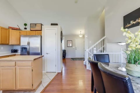 The entry living room seamlessly opens to the kitchen and dining area.