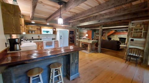 Open concept kitchen, dining and living room.