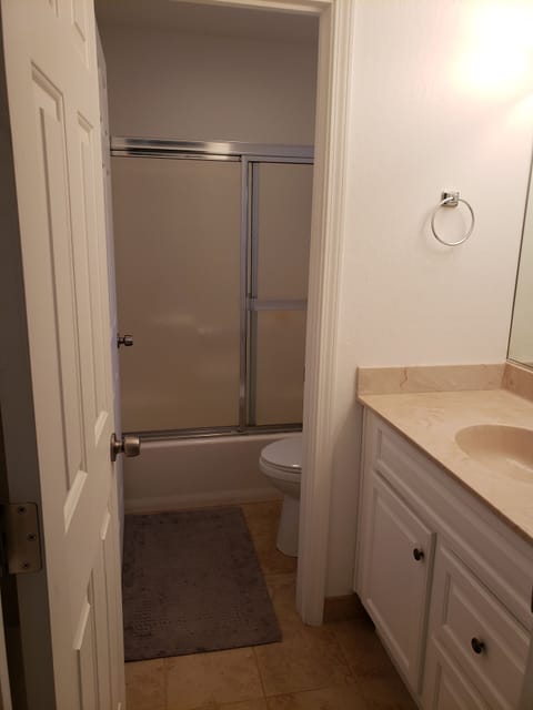 Combined shower/tub, hair dryer, towels, soap