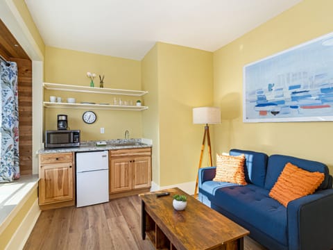 Love seat with adjustable lift-top coffee table.
Kitchenette with microwave, coffee maker, mini-fridge, toaster, dishes, towel, sponge, soap and paper towels. 

++ADULTS ONLY UNIT++