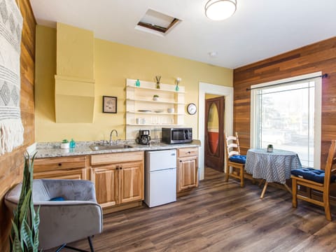 Cozy Corner Suite #3 has a kitchenette with microwave, coffee maker, toaster, mini-fridge, dishes, towel, sponge, soap and paper towels.
Dining table for two to enjoy morning coffee and a little breakfast.
++ADULTS ONLY++