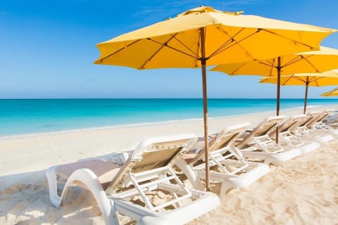 On the beach, sun loungers, beach towels