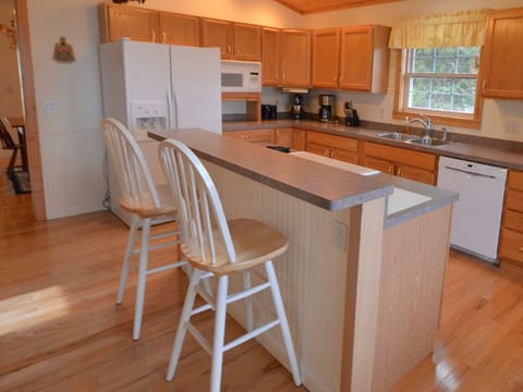 Kitchen equipped with refrigerator, dishwasher, electric range and more!