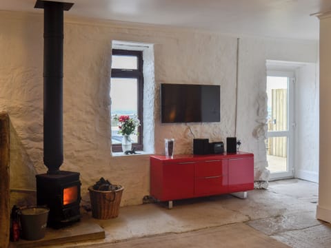 Contemporary kitchen area with traditional wood burner | The Calving Shed, Near Neilston