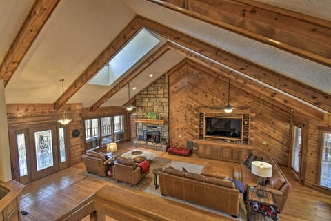 Living Room | Ample Seating | Stone Wood-Burning Fireplace | 75-Inch Smart TV
