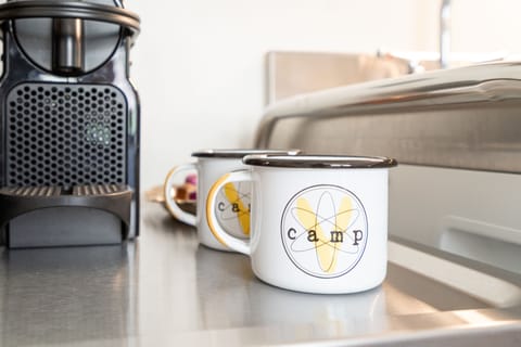 Nespresso coffee makers and CampV mugs.