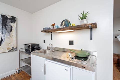 Kitchenettes have toaster ovens, two burner stovetops and mini fridges.