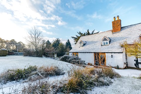 back of main farmhouse house with enclosed garden