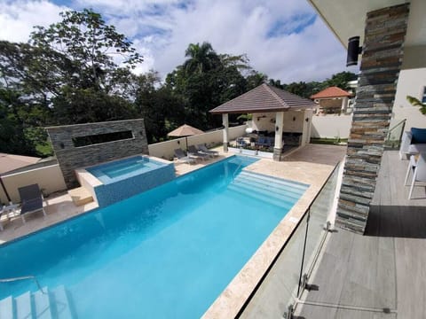 Outdoor pool, a heated pool, sun loungers