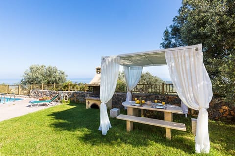 BBQ facilities available next to a lovely dining area.