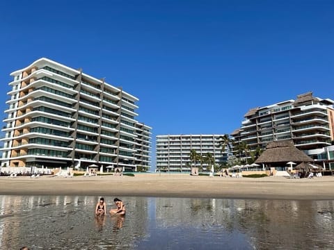 On the beach, sun loungers, beach towels