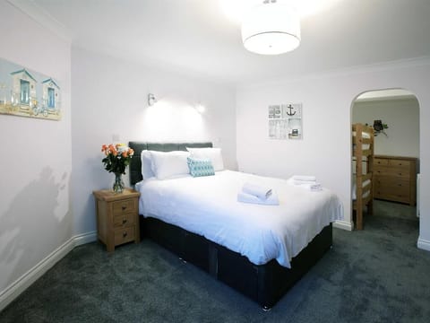 apartment 1,master bedroom/ bunkbed area through arch way