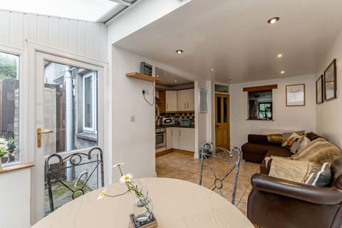 View from sunroom back to living space and kitchen