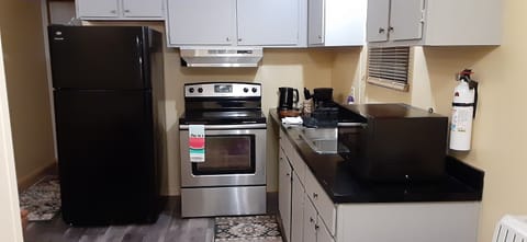 Fridge, microwave, stovetop, coffee/tea maker