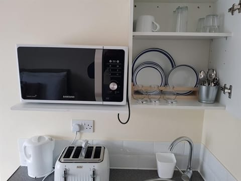 Fridge, microwave, coffee/tea maker, toaster