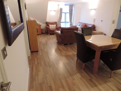 Dinning area open plan with lounge area with sea views