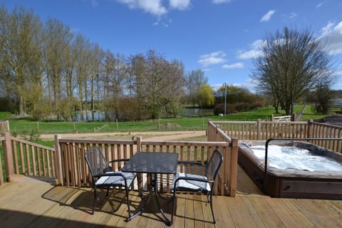 Private veranda with hot tub, BBQ & lake views