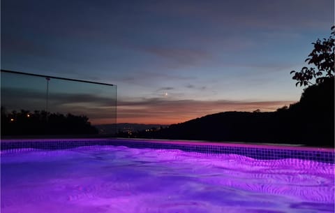 A heated pool, sun loungers