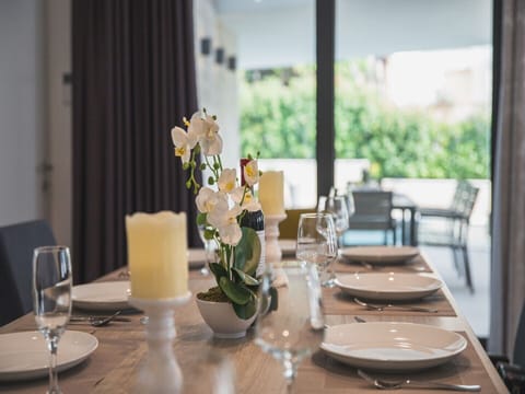 Dining table in a Croatia luxury family villa Trogir 3 with private pool and sea view
