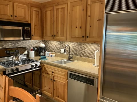 Kitchen with Sub-Zero fridge, dishwasher, garbage disp., gas range and micro