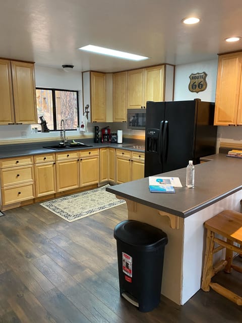 Kitchen area w/microwave, large refrigerator with ice make and water dispenser. 