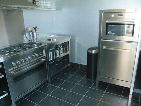 Fridge, dishwasher, coffee/tea maker, dining tables